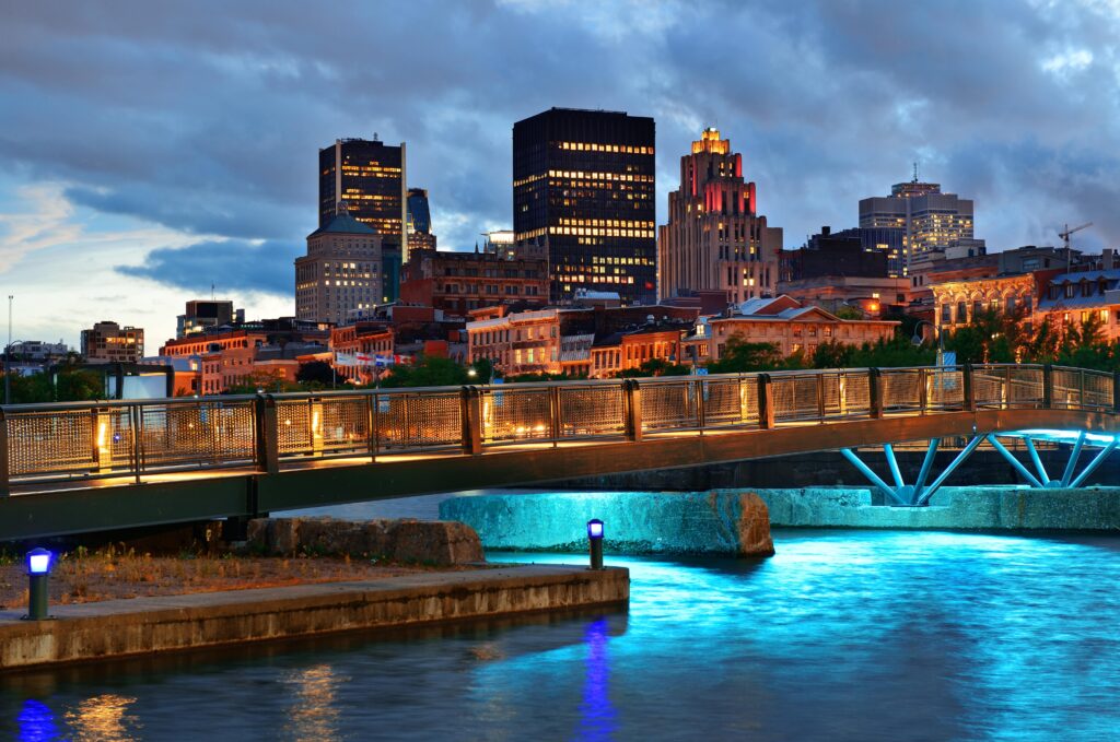 "Cityscape of Montreal with a clear view of urban architecture and waterway."